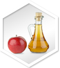 Apple and glass bottle of apple cider vinegar, highlighting acv gummies with the mother for optimal health benefits.