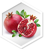 Whole and sliced pomegranate with leaves, highlighting a natural ingredient in acv gummies with the mother.